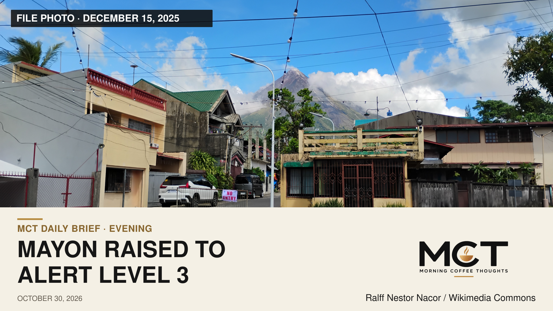 Mayon behind buildings in Camalig on December 15, 2025. File photograph, not the October 30, 2026 eruption.