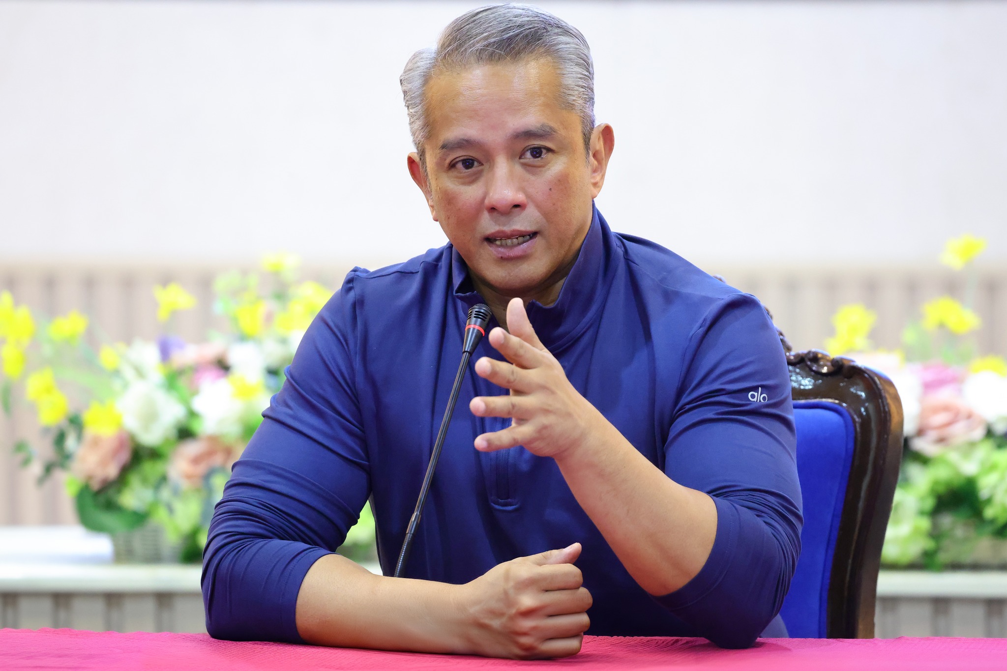 Archival photograph of Jonvic Remulla speaking at a microphone, published April 7, 2026.